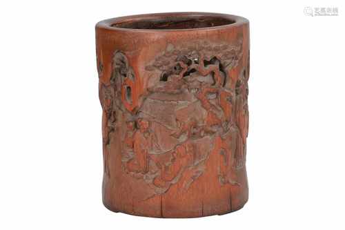 A bamboo brush pot with carved decor of figures in a mountainous landscape. Dated 1921. China,