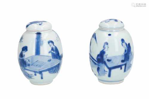 A lot of two blue and white porcelain lidded tea caddies, decorated with long Elizas playing