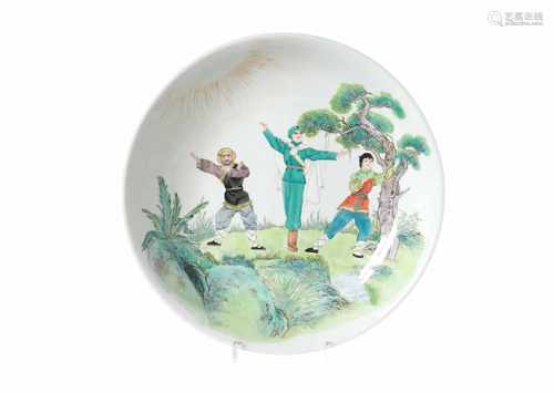 A polychrome porcelain charger, decorated with a scene from the Revolutionary Opera. Marked with 4-