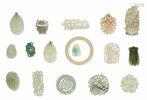 A lot of 16 jade pendants and one jade bracelet. China, 20th century.