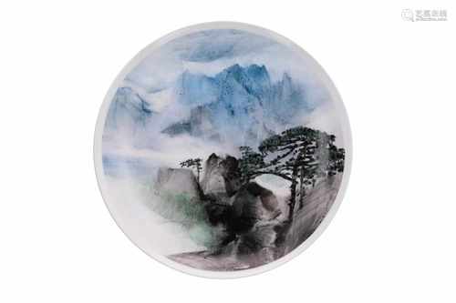 A polychrome porcelain dish depicting Mount Huangshan. Signed Li Linhong (1942), director of the