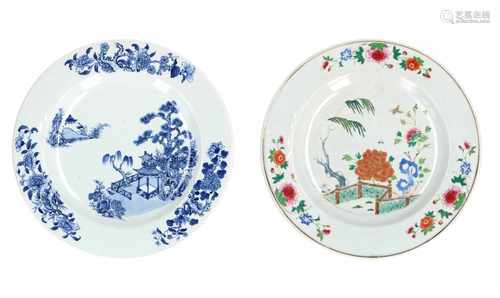 A blue and white porcelain charger with decor of flowers and pagoda. Added a Famille Rose