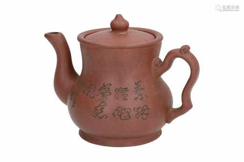 A Yixing teapot, with carved decor of flowers and calligraphy. Marked with seal mark and in cover