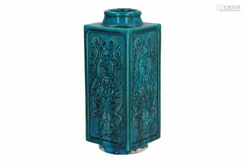 A turquoise porcelain Cong vase, decorated in relief with dragons and flowers. Marked with seal mark