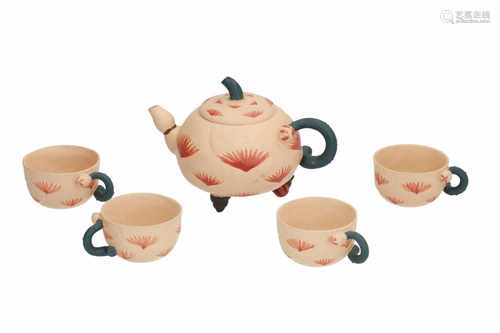 A Duan Ni Yixing tea set, including a teapot on three legs, with moving loose knobs to the base