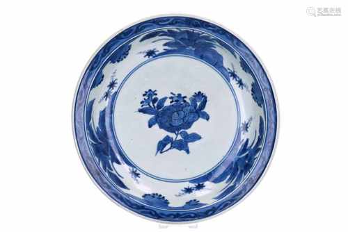 A blue and white porcelain charger, decorated with flowers. Unmarked. Japan, Arita, ca. 1700.