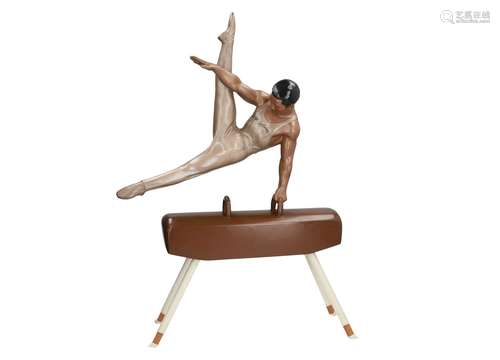 A large lacquer communistic sculpture of a gymnast on a pommel horse. Unmarked. China, Fujian,