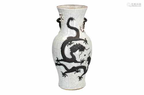 A polychrome porcelain vase, decorated with dragons in relief. Marked with seal mark. China, ca.