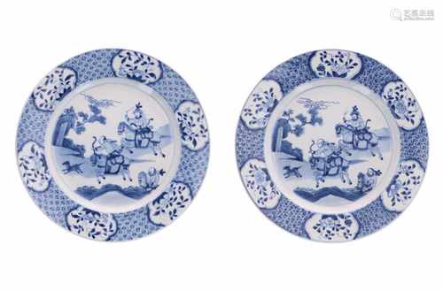 A pair of blue and white porcelain dishes, decorated with 'Joosje te paard' and flowers. Marked with