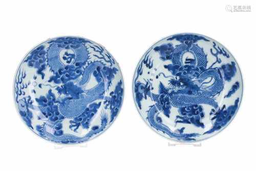 A pair of blue and white porcelain dishes, decorated with dragon and burning pearl. Marked with 6-