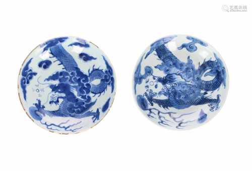 A pair of blue and white porcelain small dishes, decorated with a dragon chasing the burning