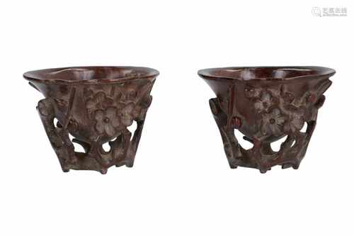 A pair of wooden libation cups, with carved decor of flowers and branches. China, 19th century. H.