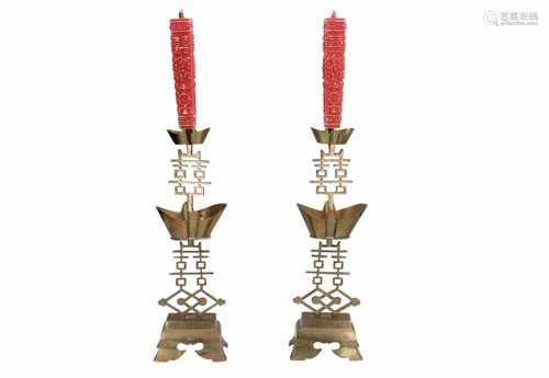 A pair of copper candlesticks with bobeches, with two candles. China, Qing, probably ca. 1900. H.