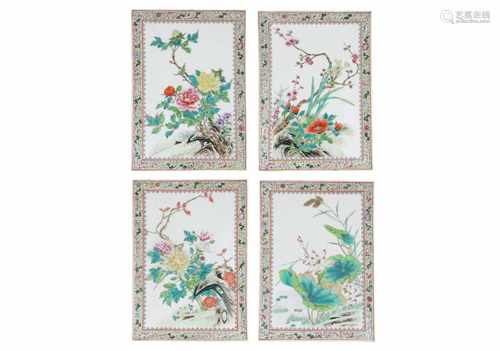 A lot of four polychrome porcelain plaques, decorated with flowers. Unmarked. China, 20th century.