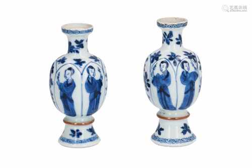 A pair of blue and white porcelain miniature vases, decorated with long Elizas, flowers and