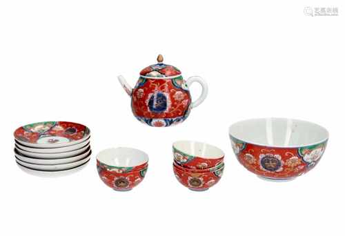 An Imari porcelain set, including a teapot, bowl, five cups and six saucers. Unmarked. Japan, 19th