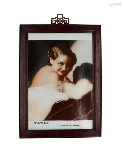 A polychrome porcelain plaque in wooden frame, decorated with a star from Hollywood with fur