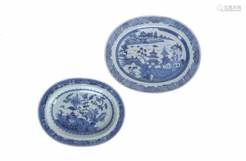 A lot of two blue and white export porcelain serving dishes. One decorated with a garden, the