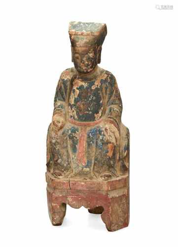 A polychrome wooden sculpture of a temple servant. China, 18th century. H. 31 cm.