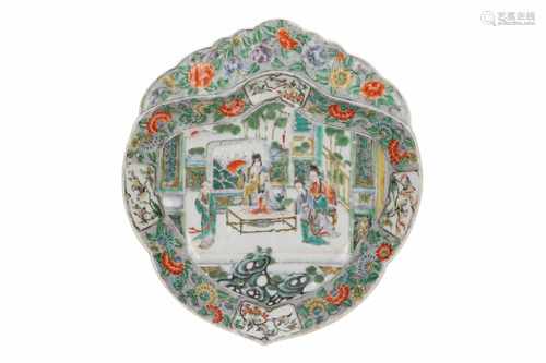 A Famille Verte porcelain leaf-shaped dish, decorated with flowers, figures and birds. Unmarked.