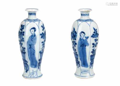 A pair of blue and white porcelain vases, decorated with long Elizas and jardinières. Marked jade.