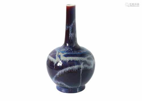 A blue flambé glazed porcelain longneck vase. Unmarked. China, 20th century. H. 32 cm.