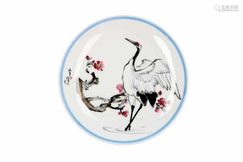 A polychrome porcelain dish, decorated with a crane and flowers. Dated 1978. Marked with seal mark