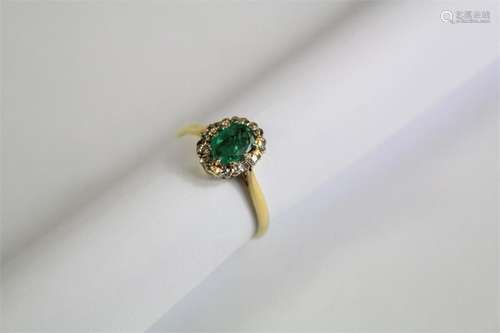 A Ladies 18ct Yellow Gold Diamond and Emerald Ring