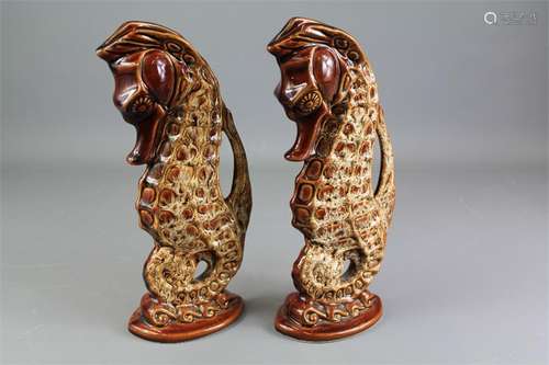 A Pair of Foster's Pottery Sea-horse Vases.