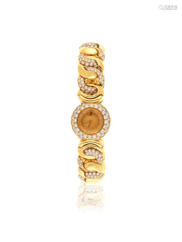Circa 2000  Audemars Piguet. A lady's 18K gold and diamond set quartz bracelet watch