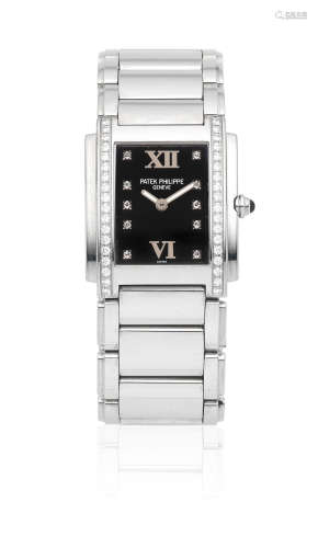 Twenty-Four, Ref: 4910/010, Circa 2000  Patek Philippe. A lady's stainless steel diamond set quartz rectangular bracelet watch