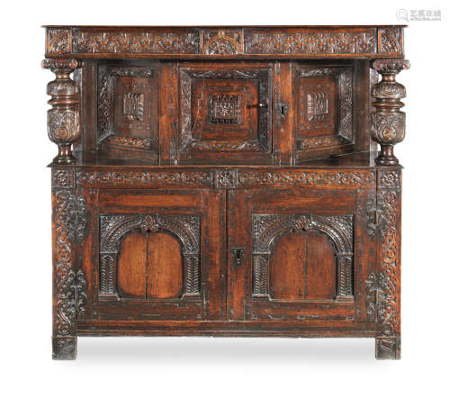 An Elizabeth I small joined oak, parquetry-inlaid and paint-highlighted court cupboard, West Country, circa 1590