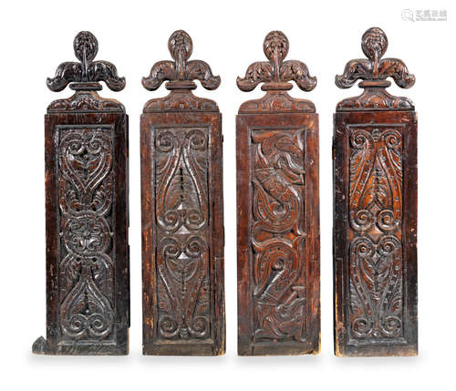 A set of four late 16th/early 17th century carved oak pew ends, probably Gloucestershire, circa 1600