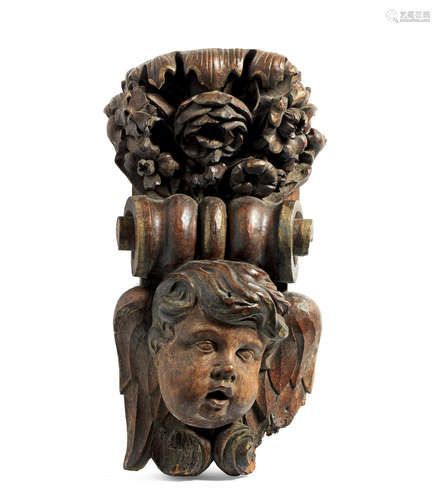 A late 17th century walnut corbel, English, with traces of parcel-gilding