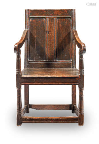 A Charles II joined oak panelled-back open armchair, Anglo-Welsh, circa 1660