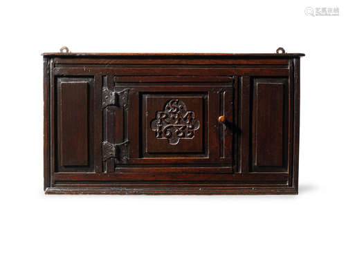 A Charles II/James II joined oak mural cupboard, Lake District, dated 1685