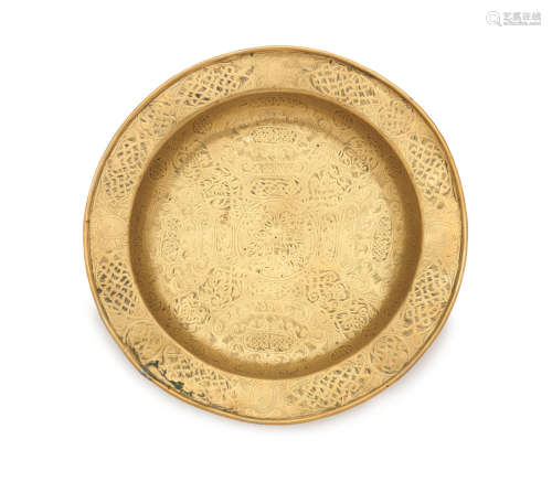 A mid-16th century engraved brass dish, Venetian, circa 1500 - 1550