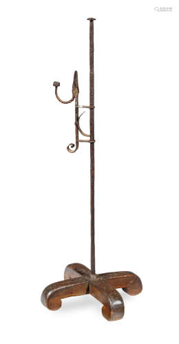 A wrought iron and oak standing rushnip