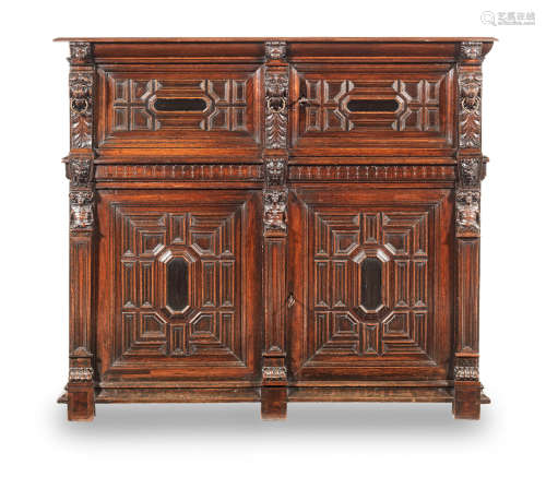 A 17th century joined oak, rosewood and ebony veneered, four-door cupboard, Flemish