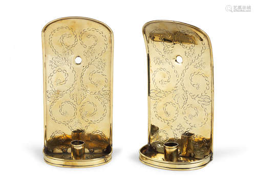 A pair of brass wall sconces