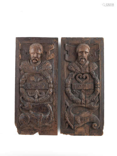 A pair of carved oak 'Romayne'-type panels, French, dated 1572