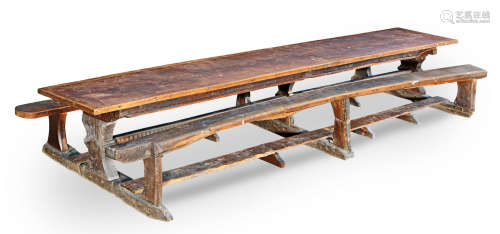 Very possibly with 16th century elements and attributed to the West Country A rare mid-17th century oak trestle table with integral fixed  benches, dated 1655