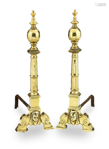 A pair of late 16th/early 17th century brass and iron andirons, French, circa 1600 - 1630
