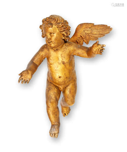 An 18th century carved giltwood winged putto, German