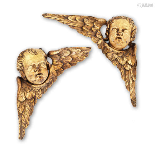 A pair of early 18th century carved gilt-limewood angels, English, circa 1700 - 1730