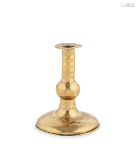 An extremely rare early to mid-17th century brass ball-knop trumpet-based candlestick, English, circa 1625 - 1675