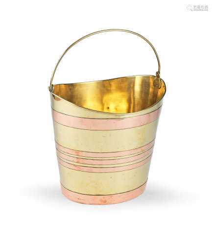 A brass and copper navette-shaped bucket