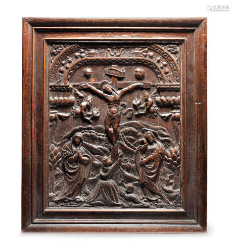 A late 16th century carved oak panel of the Crucifixion, just before the Deposition, of Christ, Flemish/German