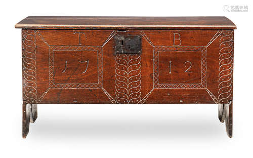 A Queen Anne boarded oak chest, dated 1712