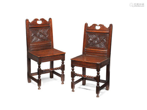 A pair of Charles II joined oak backstools, Lancashire, circa 1680